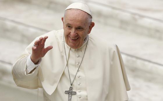 Pope Francis greets the crowd during his general audience in the Paul VI hall Jan. 26 at the Vatican. (CNS/Paul Haring)