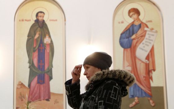 A believer attends a liturgy at the Ukrainian Greek Catholic Cathedral of the Resurrection of Christ in Kyiv, Ukraine, Jan. 26. (CNS/Reuters/Valentyn Ogirenko)