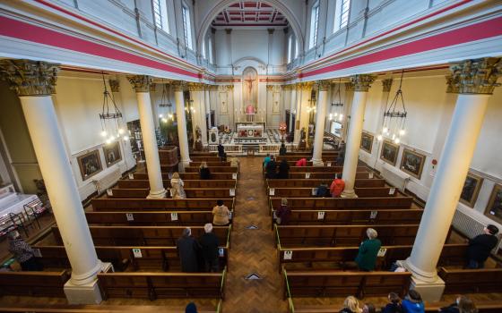 People maintain social distancing while attending Mass in the Church of Our Lady of Grace & St. Edward in London Dec. 13, 2020. (CNS photo/Marcin Mazur, courtesy Bishops' Conference of England and Wales)