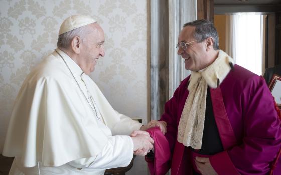 Pope Francis greets Msgr. Alejandro Arellano Cedillo, dean of the Roman Rota, during an annual audience with members of the Tribunal of the Roman Rota at the Vatican Jan. 27, 2022.. (CNS photo/Vatican Media)