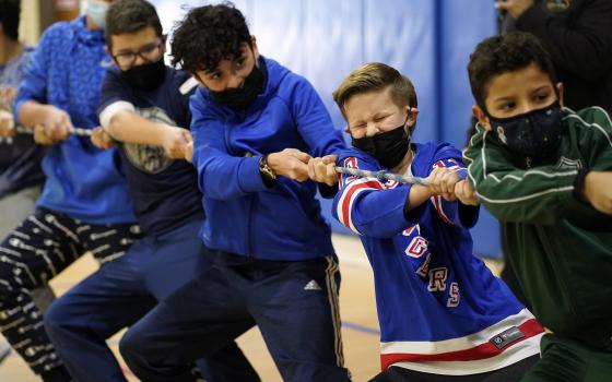 Students compete in a game of tug of war Feb. 1, 2022, at St. Patrick School in Smithtown, N.Y. The event was one of many special activities scheduled by the school to celebrate Catholic Schools Week. (CNS photo/Gregory A. Shemitz)