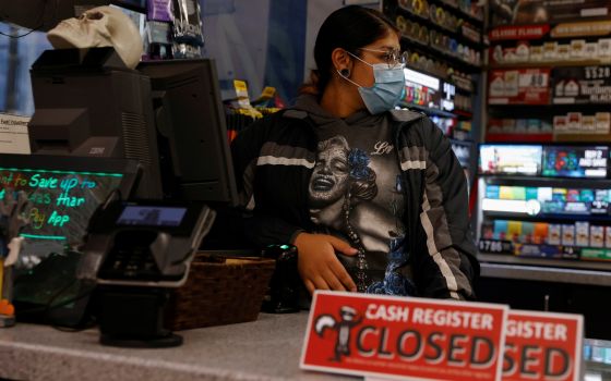 Ariana Mora of Jerome, Idaho, works while 8 months pregnant Oct. 27, 2021. (CNS photo/Shannon Stapleton, Reuters)