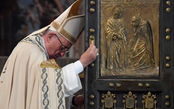 Pope Francis closes the Holy Door of St. Peter's Basilica to mark the closing of the jubilee Year of Mercy at the Vatican, Nov. 20, 2016. (CNS photo/Tiziana Fabi, pool via Reuters)