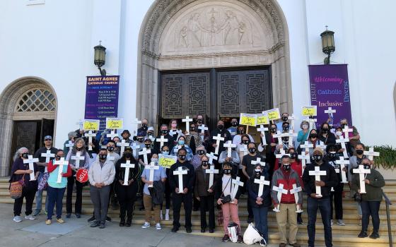 "Walk for Peace" volunteers, parishioners and community members gather before Mass at St. Agnes Church in San Francisco Feb. 5, 2022.  (CNS photo/Melissa Vlach, Archdiocese of San Francisco Office of Human Life & Dignity)