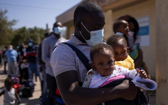 Migrants from Haiti are seen at the Val Verde Border Humanitarian Coalition after being released from U.S. Customs and Border Protection in Del Rio, Texas, March 21, 2021. (CNS photo/Adrees Latif, Reuters)