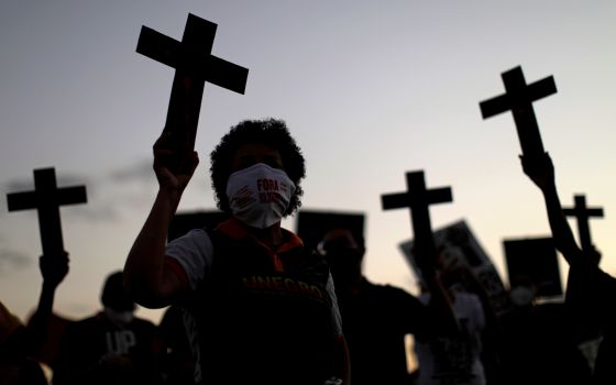 People in Brasilia, Brazil, protest racism and police violence May 13, 2021. (CNS photo/Ueslei Marcelino, Reuters)