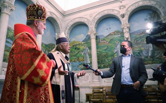 Washington Cardinal Wilton D. Gregory responds to reporters after an Ash Wednesday Mass at St. Matthew's Cathedral in Washington March 2, 2022. Also pictured is Archbishop Borys Gudziak of the Ukrainian Catholic Archeparchy of Philadelphia. (CNS photo)