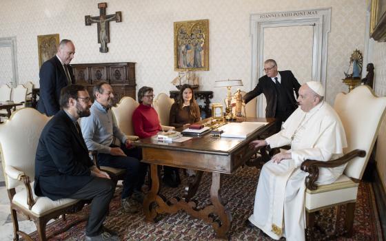 Pope Francis meets Bishop-designate Christian Carlassare of Rumbek, South Sudan, left, and his delegation during an audience at the Vatican March 14, 2022. (CNS photo/Vatican Media)