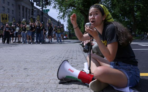 Activists protesting climate change and pushing for green jobs are seen near the White House in Washington June 4, 2021. (CNS/Reuters/Evelyn Hockstein)