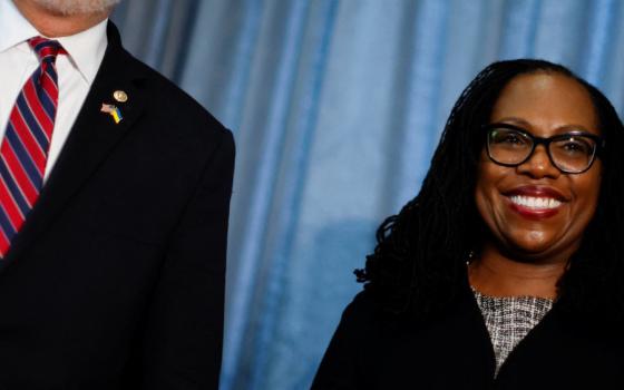 Supreme Court nominee Ketanji Brown Jackson, a federal appeals court judge, smiles during a meeting with Sen. Gary Peters, D-Mich., on Capitol Hill in Washington March 31, 2022. (CNS/Reuters/Jonathan Ernst)