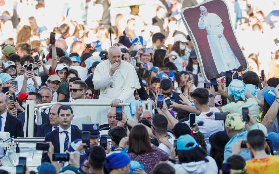 Pope Francis waves as he arrives for a meeting with thousands of young people taking part in a pilgrimage organized by the Italian bishops' conference in St. Peter's Square at the Vatican April 18, 2022. (CNS photo/Remo Casilli, Reuters)