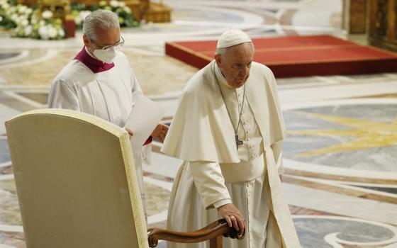 Pope Francis arrives at his seat as he participates in Mass marking the feast of Divine Mercy in St. Peter's Basilica at the Vatican April 24, 2022. (CNS photo/Paul Haring)