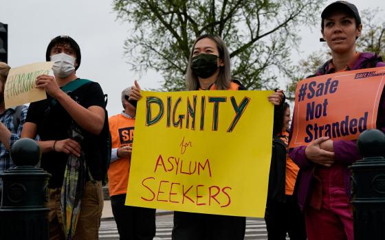 People in support of asylum seekers rally near the Supreme Court in Washington April 26, 2022. (CNS photo/Elizabeth Frantz, Reuters)