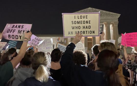 People in Washington react outside the U.S. Supreme Court May 2, 2022. (CNS photo/Moira Warburton, Reuters)