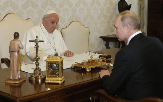 Pope Francis greets Russian President Vladimir Putin during a private audience at the Vatican in this July 4, 2019. (CNS photo/Paul Haring)