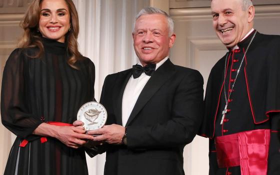 Archbishop Gabriele Caccia, the Vatican's permanent observer to the United Nations, presents the Path to Peace Award to Jordan's King Abdullah II and his wife, Queen Rania, May 9, 2022, in New York City. (CNS photo/Joe Vericker via Permanent Observer Miss