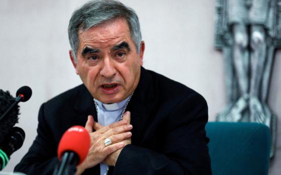 Cardinal Angelo Becciu speaks with journalists during a news conference in Rome in this Sept. 25, 2020, file photo. (CNS photo/Guglielmo Mangiapane, Reuters)