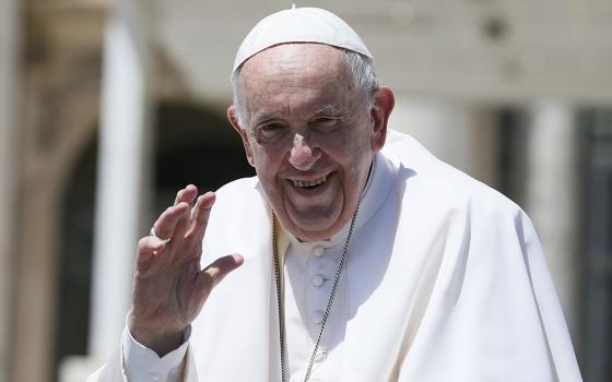 Pope Francis waves as he leaves his general audience in St. Peter's Square at the Vatican June 8. (CNS/Paul Haring)