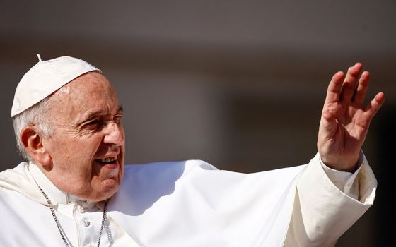 Pope Francis greets people as he arrives for his general audience in St. Peter's Square June 15 at the Vatican. (CNS/Reuters/Yara Nardi)