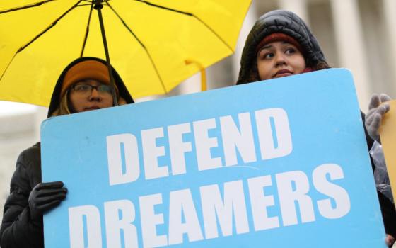 Supporters of Deferred Action for Childhood Arrivals hold signs outside the U.S. Supreme Court in Washington Nov. 12, 2019. (CNS/Reuters/Jonathan Ernst)