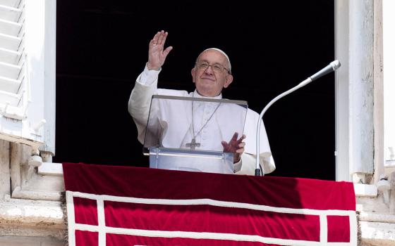 Pope Francis greets the crowd as he leads the Angelus from the window of his studio overlooking St. Peter's Square at the Vatican June 26. (CNS/Vatican Media)