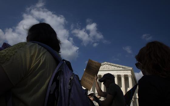 Abortion demonstrators are seen near the Supreme Court June 24 in Washington, as the court overruled the landmark Roe v. Wade abortion decision in its ruling in the Dobbs case on a Mississippi law banning most abortions after 15 weeks. (CNS/Tyler Orsburn)