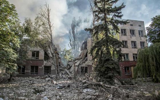 Smoke rises from a destroyed building after A Russian military airstrike in Lysychansk, Ukraine, June 17. (CNS/Reuters/Oleksandr Ratushniak)