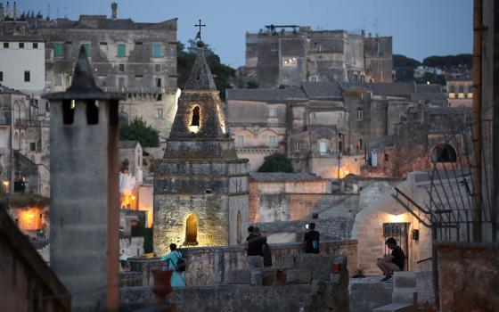 People enjoy the evening in Matera, Italy, June 29, 2021. Pope Francis will visit the southern Italian city Sept. 25 to celebrate the closing Mass of the Italian National Eucharistic Congress. (CNS/Reuters/Yara Nardi)