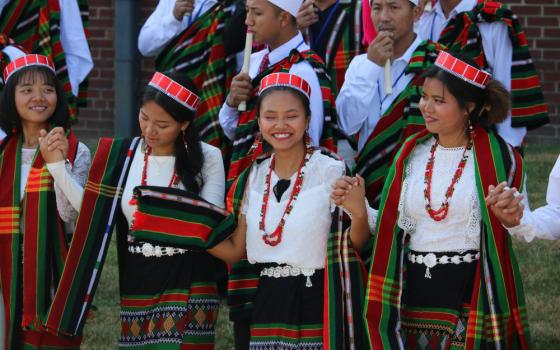 Women in traditional attire participate in a procession July 2, 2022, during the National Catholic Burmese-American Conference in Owensboro, Ky. (CNS photo/Riley Greif, The Western Kentucky Catholic)