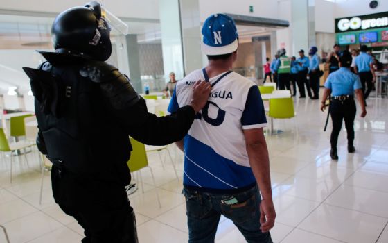 A protester is picture in a file photo being detained during a demonstration against Nicaraguan President Daniel Ortega's government in Managua. 