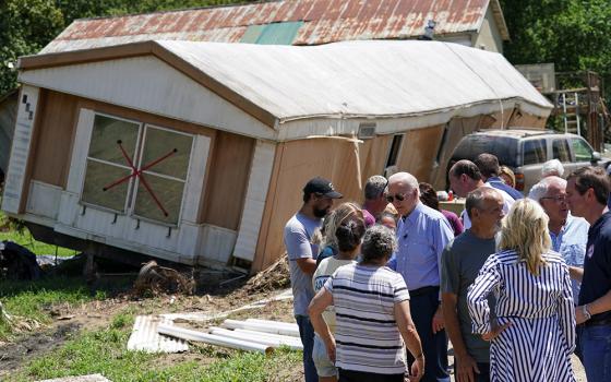 President Joe Biden on Aug. 8 meets with residents affected by the recent flooding in Lost Creek, Kentucky. (CNS/Reuters/Kevin Lamarque)