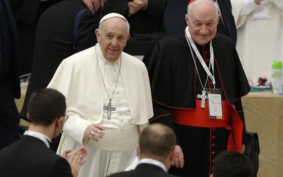 Pope Francis walks next to Cardinal Marc Ouellet as he arrives to open an international symposium on priesthood at the Vatican in this Feb. 17 file photo. (CNS/Paul Haring)