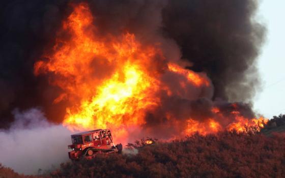 A bulldozer is at the edge of the Route Fire burning near Castaic, Calif., Aug. 31, 2022. (CNS photo/David Swanson, Reuters)