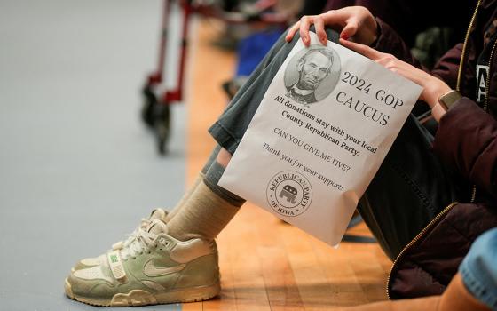 A person holds a donation flyer at a caucus site to choose a Republican presidential candidate at Fellows Elementary School in Ames, Iowa, Jan. 15, 2024. (OSV News/Reuters/Cheney Orr)