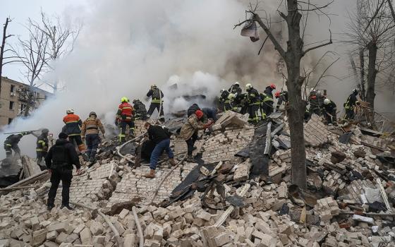 Rescuers work at the site of a residential building in Kharkiv, Ukraine, Jan. 23, 2024, that was heavily damaged in a Russian missile attack. (OSV News/Reuters/Sofiia Gatilova)