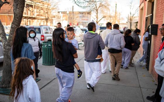 A family of migrants is dropped off by a transport contractor for U.S. Customs and Border Protection at a shelter run by Annunciation House in downtown El Paso, Texas, Dec. 13, 2022. (OSV News/Reuters/Ivan Pierre Aguirre)