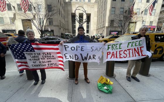 Members of the New York Catholic Worker community are pictured outside St. Patrick's Cathedral during one of their Sunday witness actions. (Courtesy of Liam Myers)