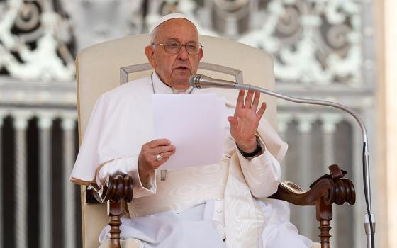 Pope Francis speaks to visitors in St. Peter's Square during his general audience at the Vatican May 29, 2024. (CNS/Lola Gomez)