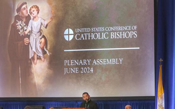 Bishop Daniel Flores of Brownsville, Texas, speaks June 13 at the U.S. Conference of Catholic Bishops' Spring Plenary Assembly in Louisville, Kentucky. (OSV News/Bob Roller)