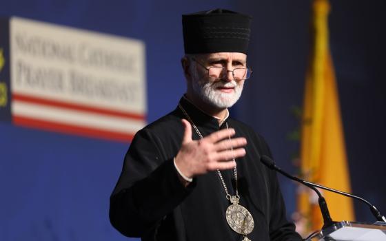 Bishop speaks from lectern