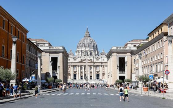 St. Peter's viewed from road lines with buildings. 