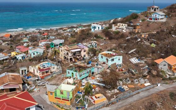 Scattered debris and houses with missing roofs are seen in a drone photograph July 2, 2024, after Hurricane Beryl passed the island of Petite Martinique, Grenada. (OSV News/Reuters/Arthur Daniel)