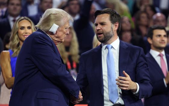 Republican presidential nominee and former President Donald Trump and Republican vice presidential nominee J.D. Vance interact during the Republican National Convention in Milwaukee July 15. Trump was shot in the ear July 13 in an assassination attempt during a campaign rally in Butler, Pennsylvania, that also claimed the life of at least one spectator and critically injured two others before the shooter was shot dead by the Secret Service. (OSV News/Reuters/Andrew Kelly)