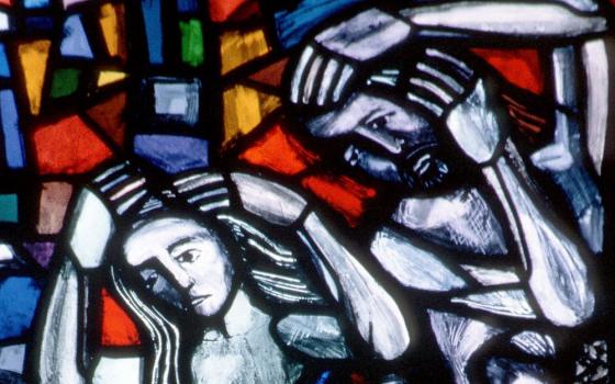 Adam and Eve depicted in stained glass