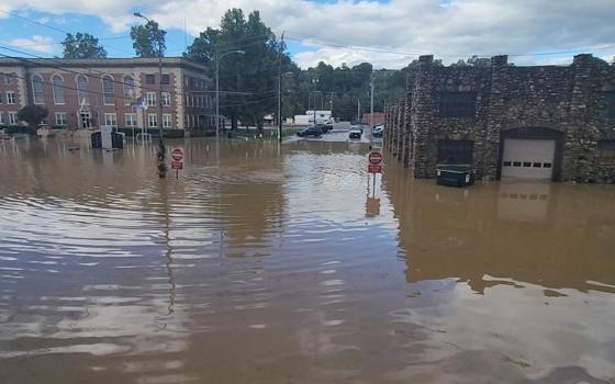 Floodwaters surround buildings Sept. 27 in Newport, Tennessee, in the aftermath of Hurricane Helene. (OSV News/Curtis Hance/H&H Vapors via Reuters)