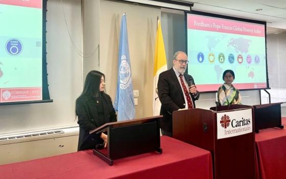 Henry Schwalbenberg, economics and development professor at Fordham University, and  research assistants Ana Barragán and Genevieve Connell present the 2024 Fordham Francis Index at the United Nations Church Center in New York on Nov. 15. The report showed that efforts to alleviate global poverty have slowed. (NCR photo/Camillo Barone)