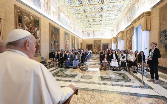 Pope Francis listens as he meets women participating in or assisting the Synod of Bishops in the Apostolic Palace at the Vatican Oct. 19, 2024. (CNS/Vatican Media)