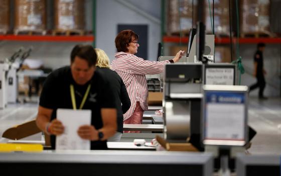 Election officials scan ballots in Philadelphia during the U.S. presidential election on Election Day, Nov. 5, 2024. (OSV News/Reuters/Rachel Wisniewski)