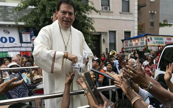 Msgr. Jamie Gigantiello, pastor of Our Lady of Mount Carmel-Annunciation Parish, speaks with parishioners, July 16, 2022, in the Brooklyn borough of New York. (AP photo/Julia Demaree Nikhinson, File)