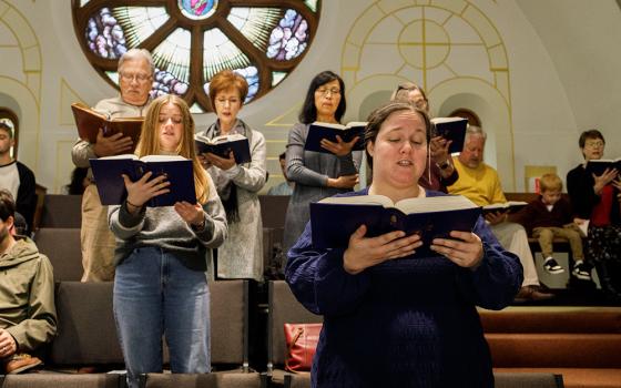 Choir members perform at Sacred Heart Catholic Church during morning Mass in Columbia, Missouri, on Sunday, Nov. 3. (Artem Baidala)